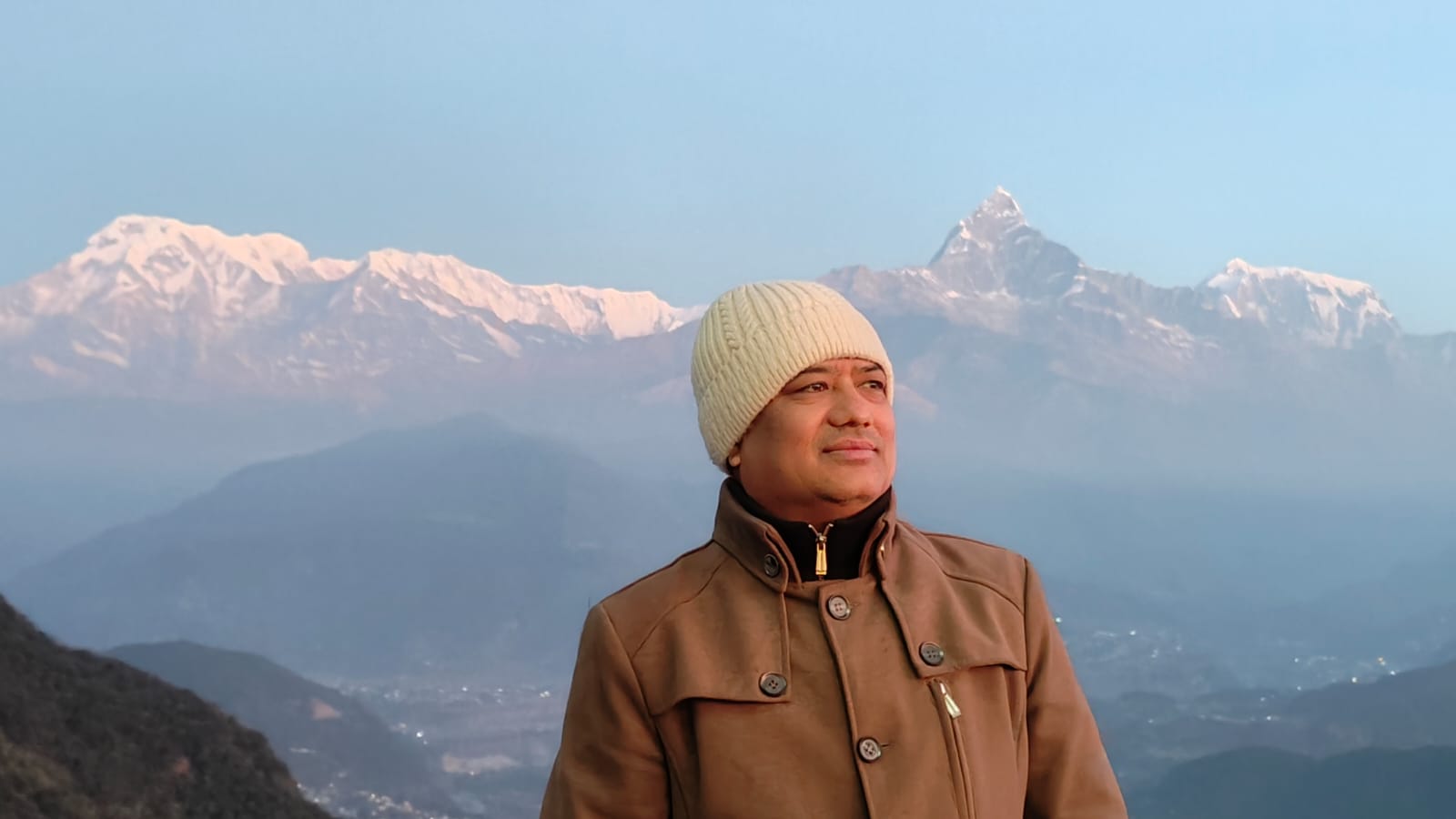 Amir Shakya overlooking the Annapurna range at sunrise